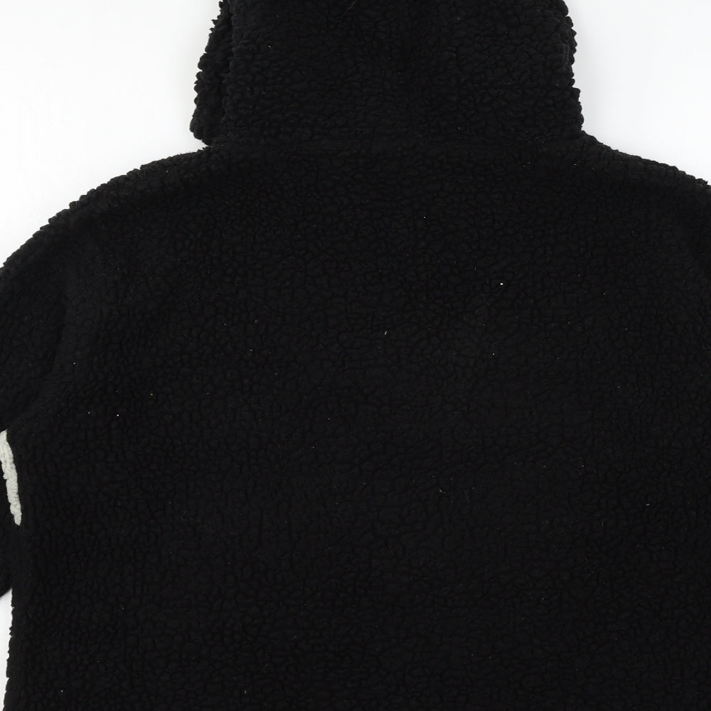 Brand and care label for PRETTYLITTLETHING women’s black jacket, size UK 10