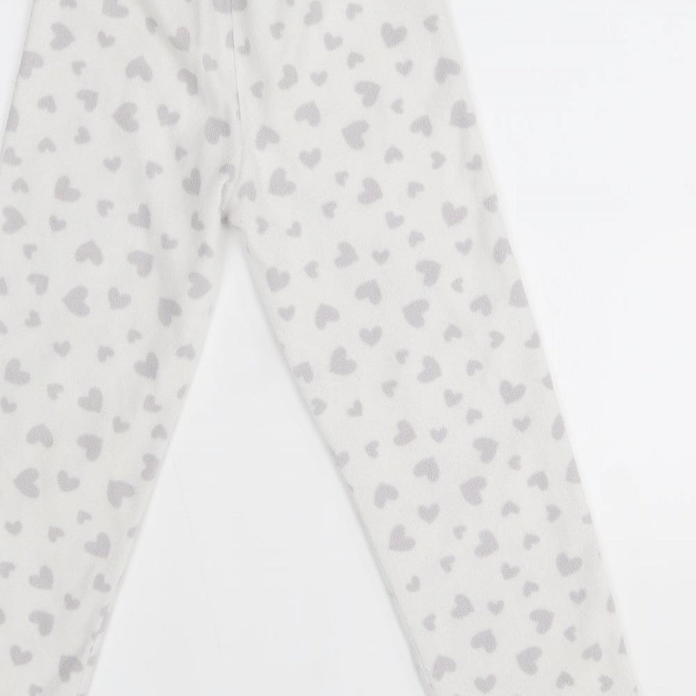 Brand and care label for George girls’ white lounge pants, size 7-8, years - heart pattern