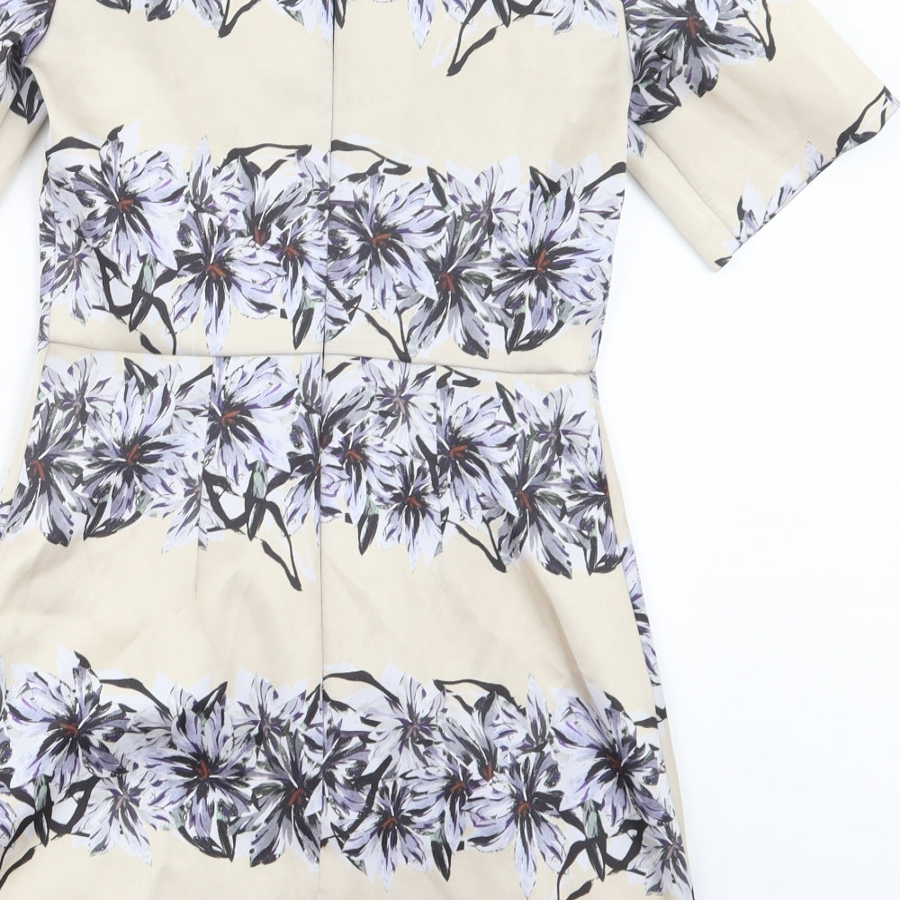 Brand and care label for Topshop women’s beige floral a-line, size UK 8