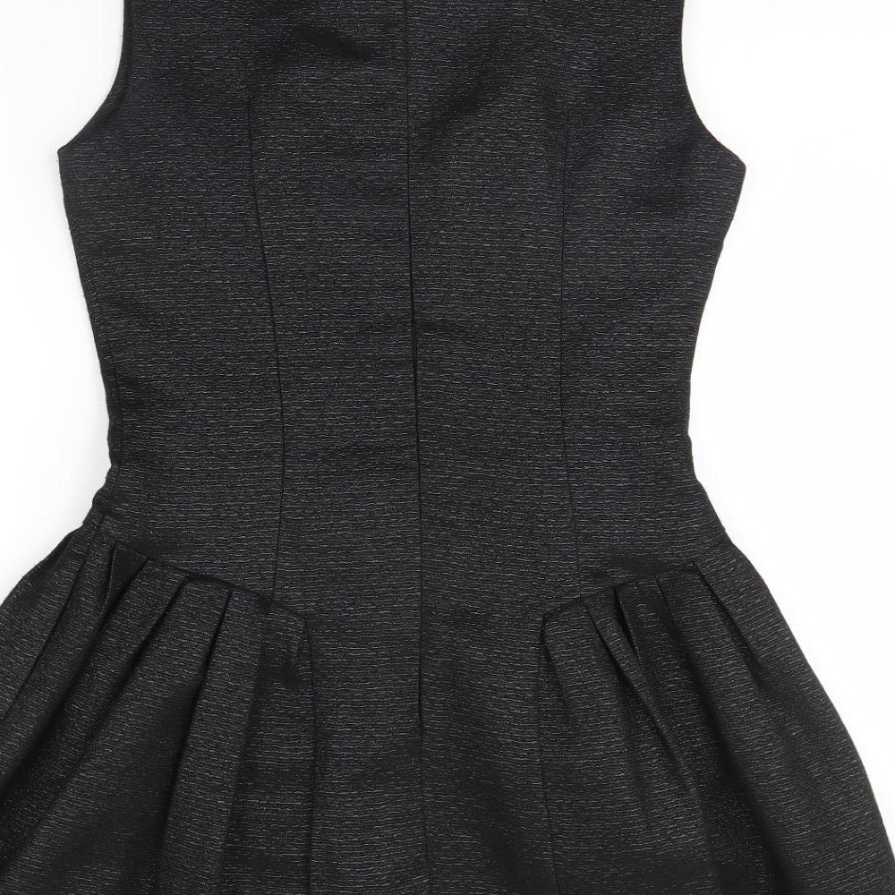 Brand and care label for Forever 21 women’s black fit & flare, size S