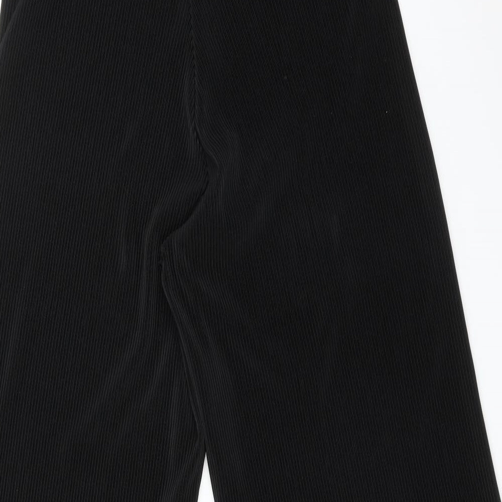 Brand and care label for F&F women’s black striped carrot trousers, size UK 12, 23-inch leg