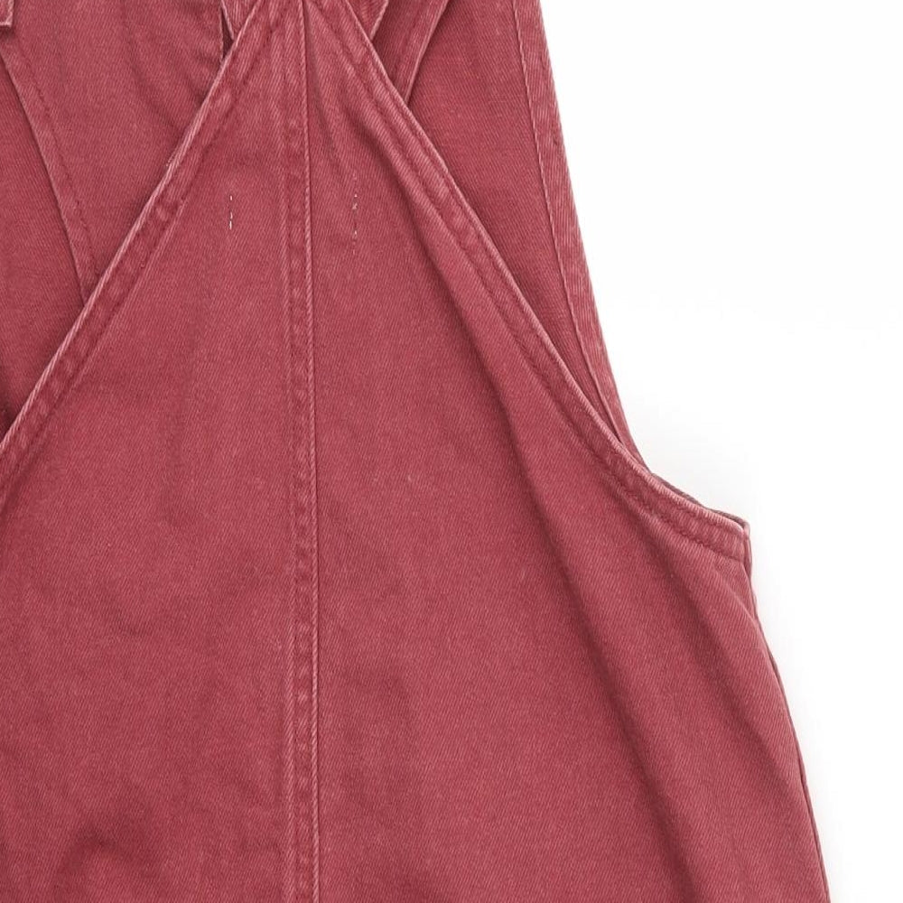 Brand and care label for Forever 21 women’s pink pinafore/dungaree dress, size M