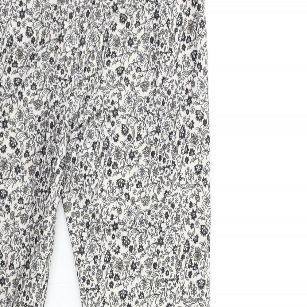 Brand and care label for New Look women’s white floral denim trousers, size UK 10, 26-inch leg