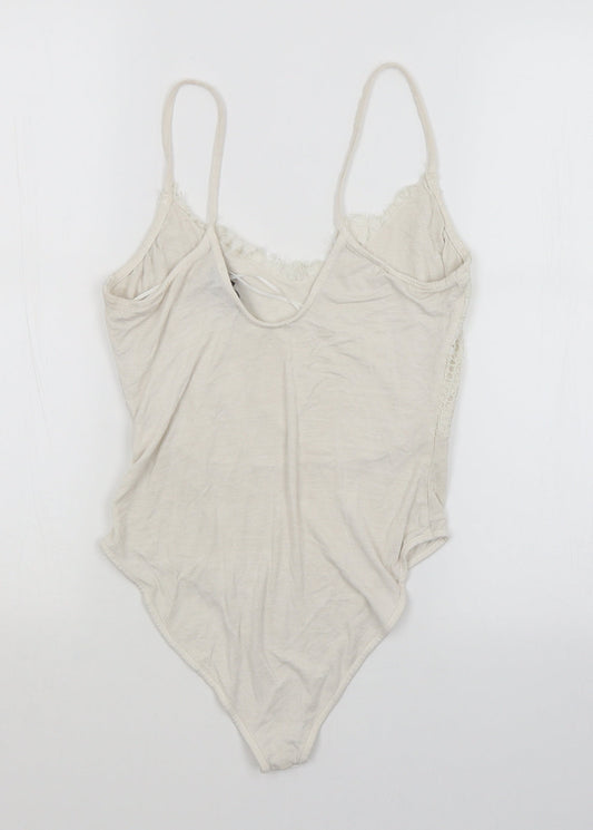 Back view of Primark women’s white unitard one-piece
