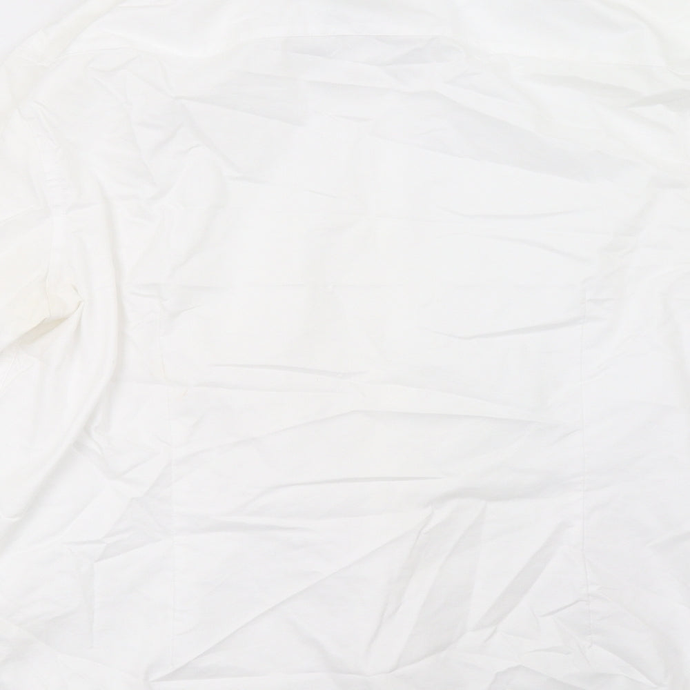 Brand and care label for Burton men’s white polo, size 18