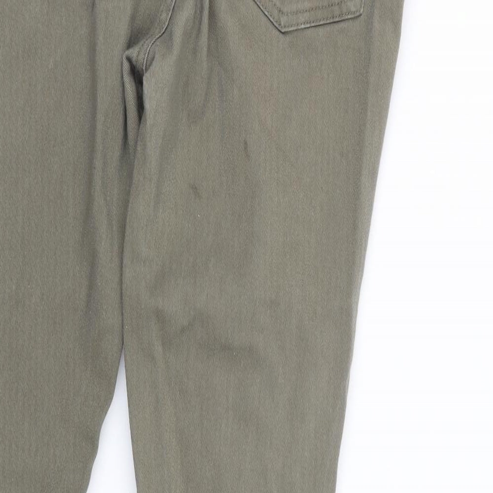 Brand and care label for Denim Co. men’s green skinny jeans, size 31, in, 28-inch leg