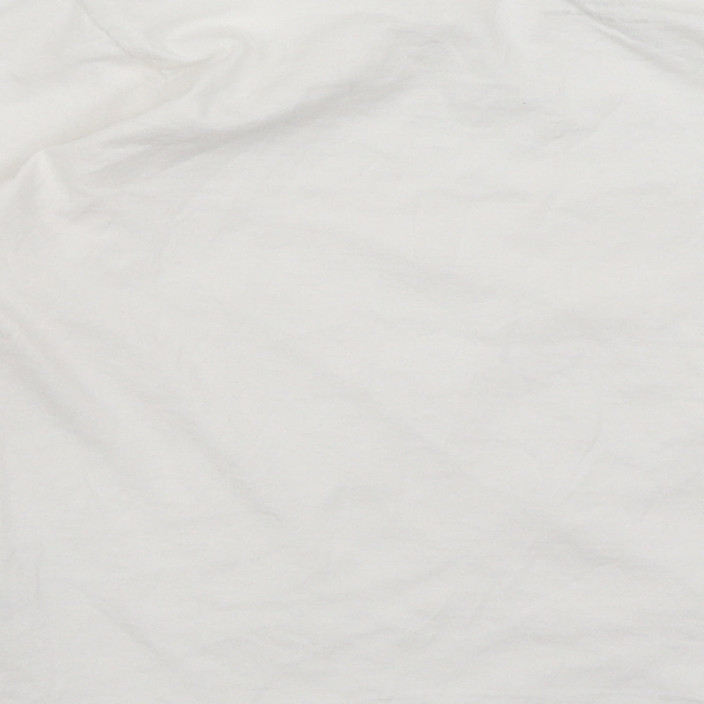 Brand and care label for Primark girls’ white basic t-shirt, size 6-7, years