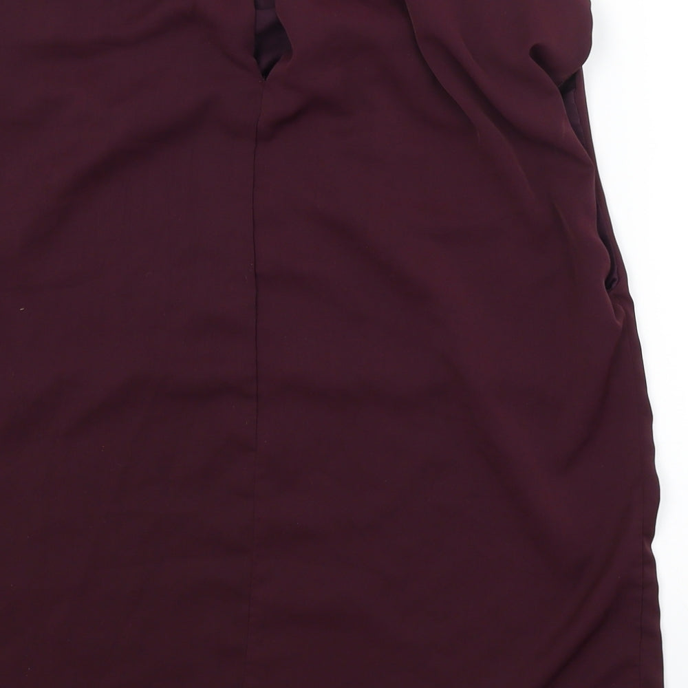 Brand and care label for AX Paris women’s purple basic blouse, size UK 10