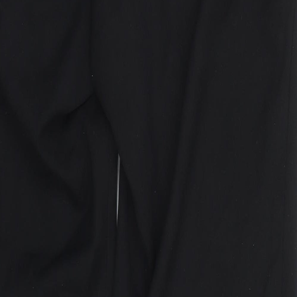 Brand and care label for Burton women’s black trousers, size UK 32, in, 30-inch leg