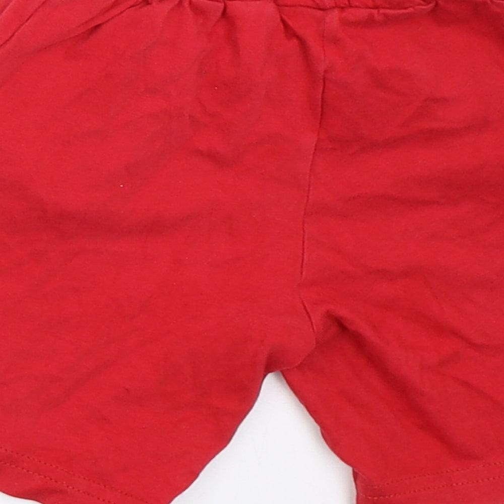 Brand and care label for EMC boys’ red sweat shorts, size 2, years