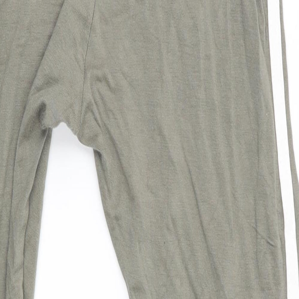 Brand and care label for Boohoo women’s green track pants leggings, size UK 10, 26-inch leg