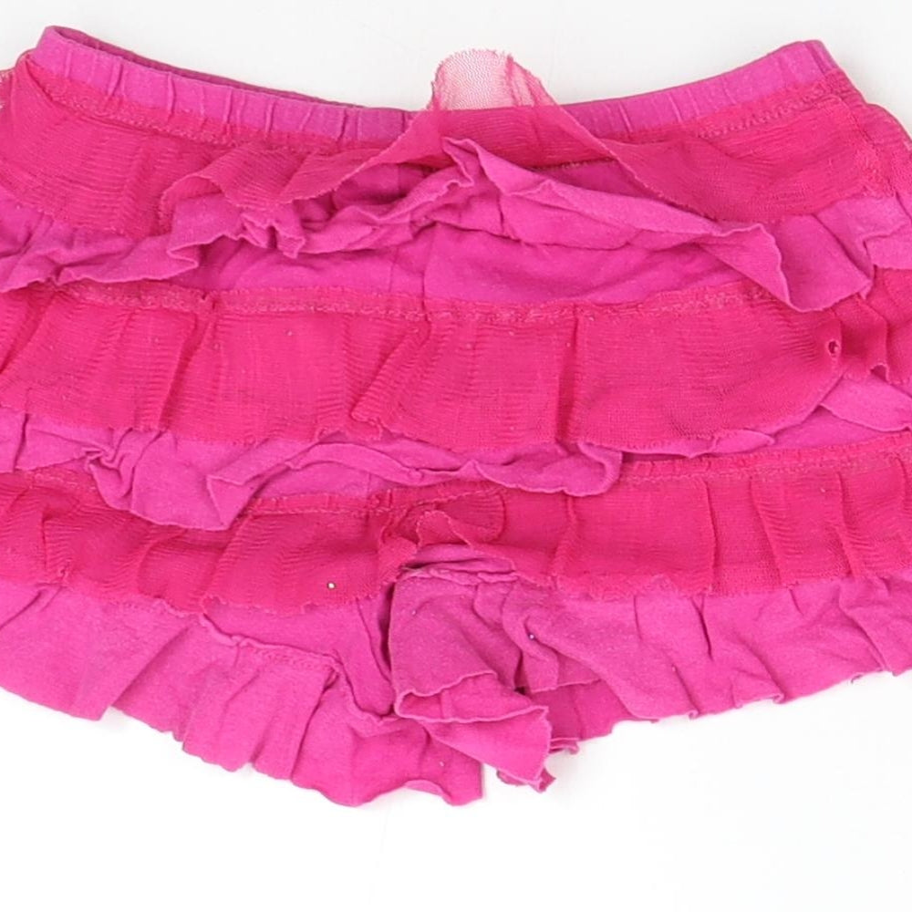 Brand and care label for 1989 Place girls’ pink hot pants shorts, size 4, years
