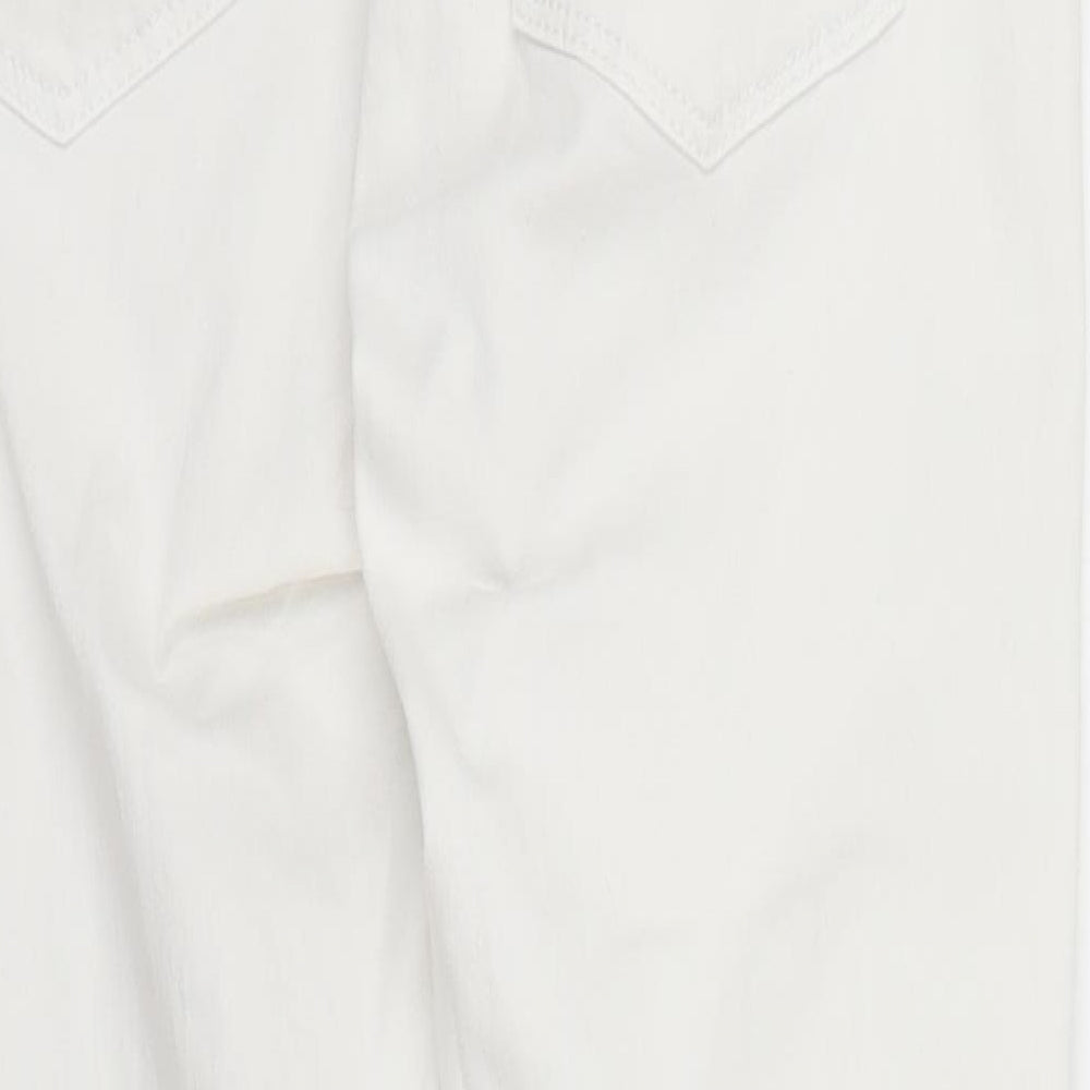 Brand and care label for Topshop women’s white denim skinny jeans, size S, 26-inch leg