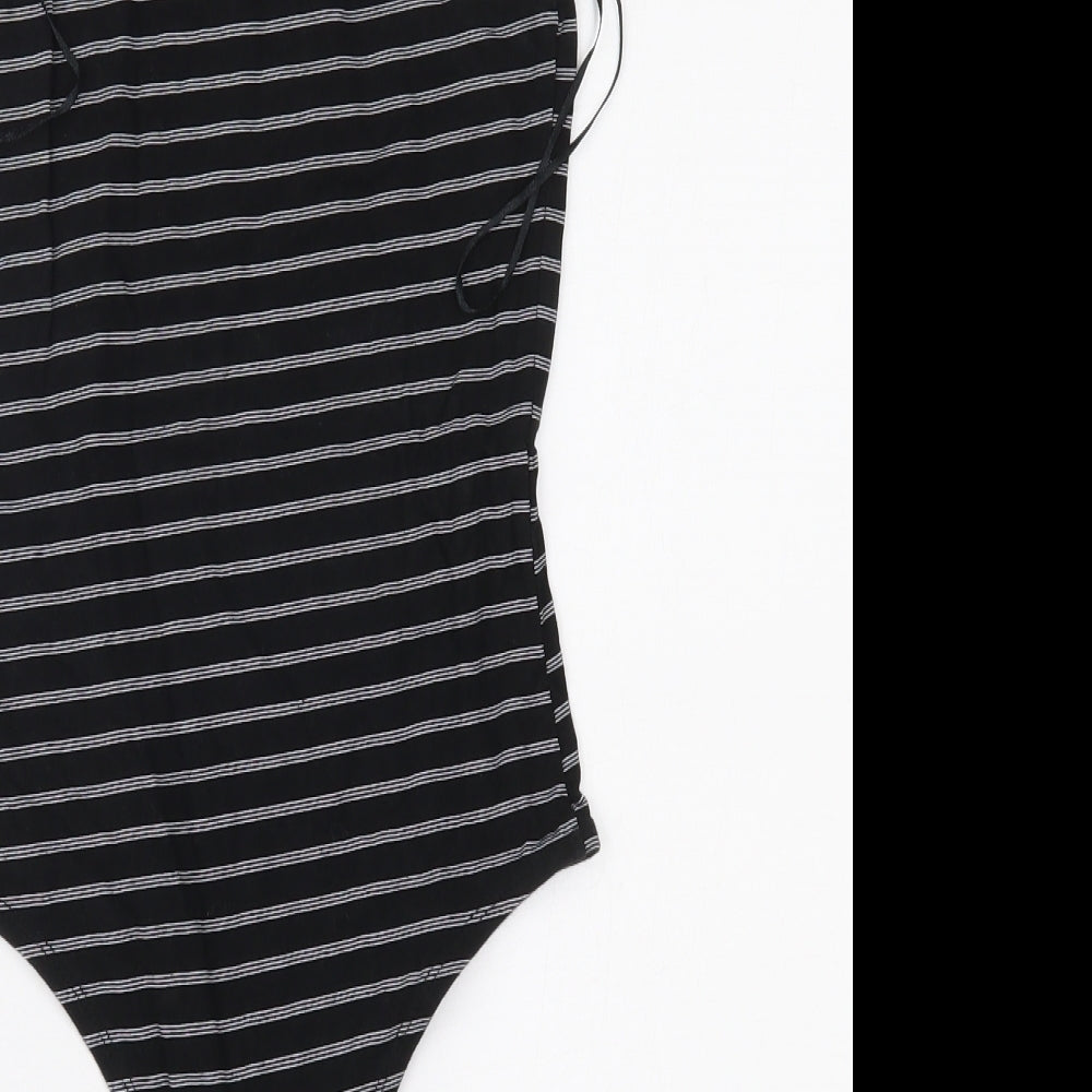 Brand and care label for Primark women’s black striped bodysuit one-piece, size S