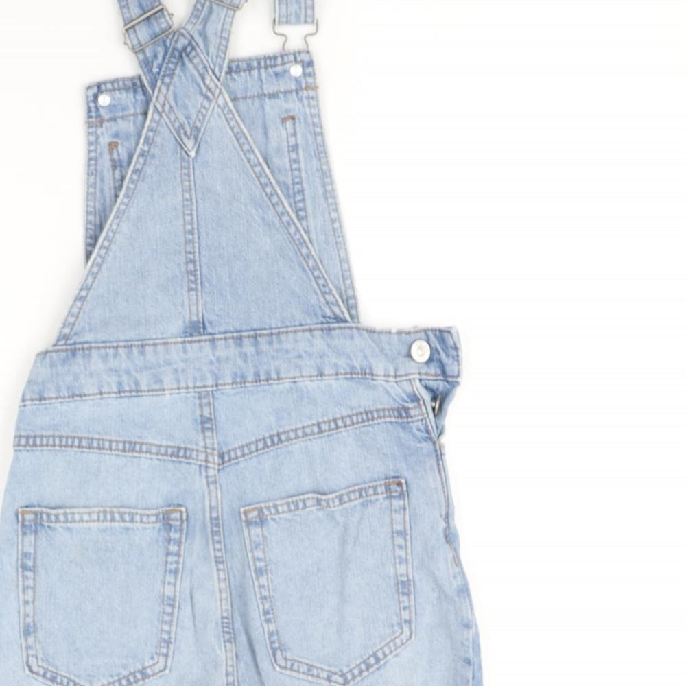 Brand and care label for H&M women’s blue dungaree one-piece, size UK 4