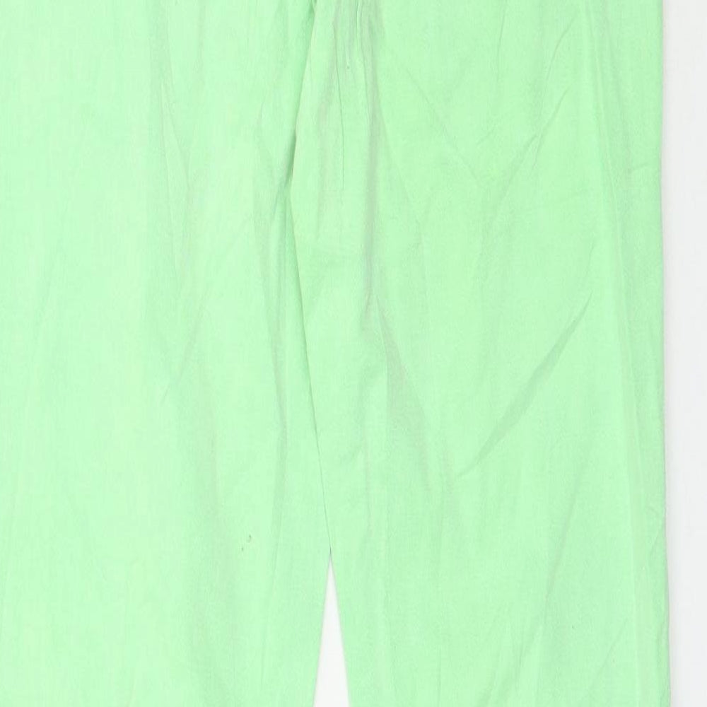 Brand and care label for Gina Tricot women’s green denim skinny jeans, size UK 12, 31-inch leg