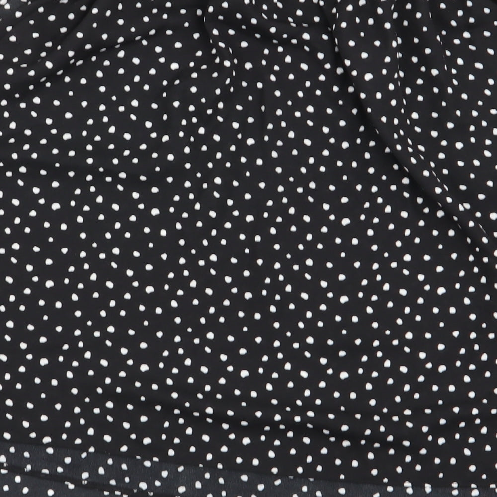 Brand and care label for Primark women’s black polka dot flare skirt, size UK 12, - stretch waistband