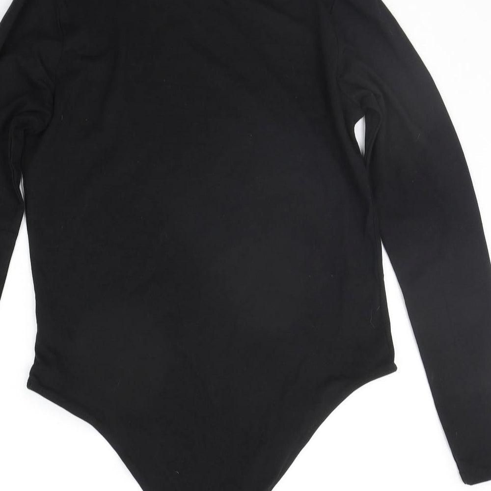 Brand and care label for Primark women’s black jumpsuit one-piece, size L