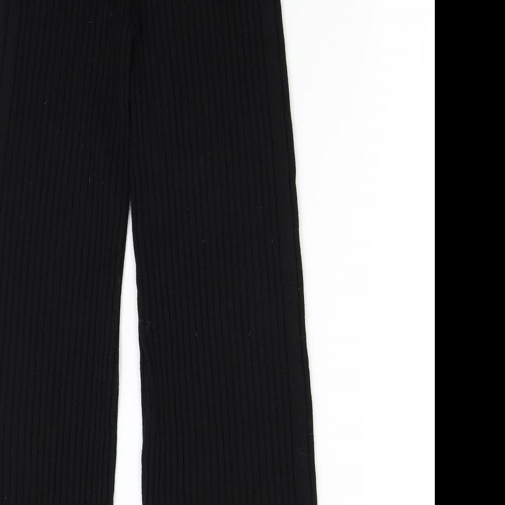 Brand and care label for Topshop women’s black trousers, size S, 28-inch leg
