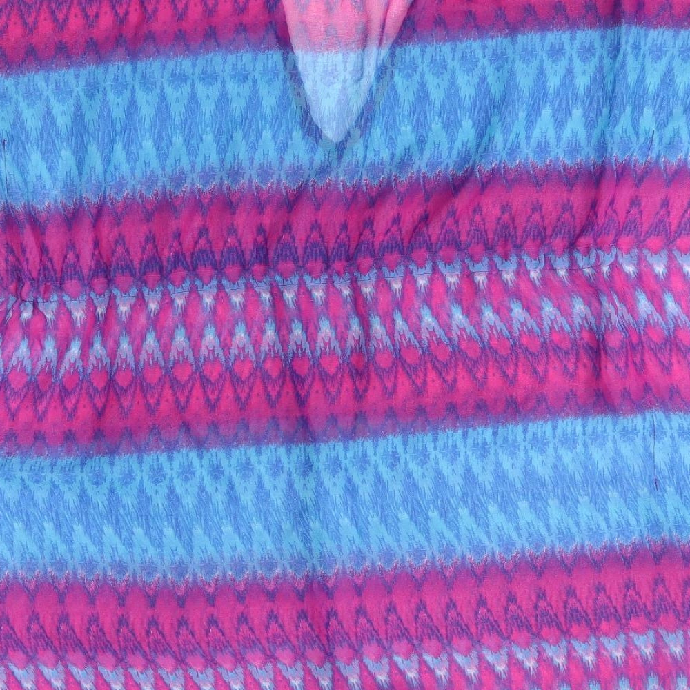 Brand and care label for Tu women’s purple striped poncho, size S