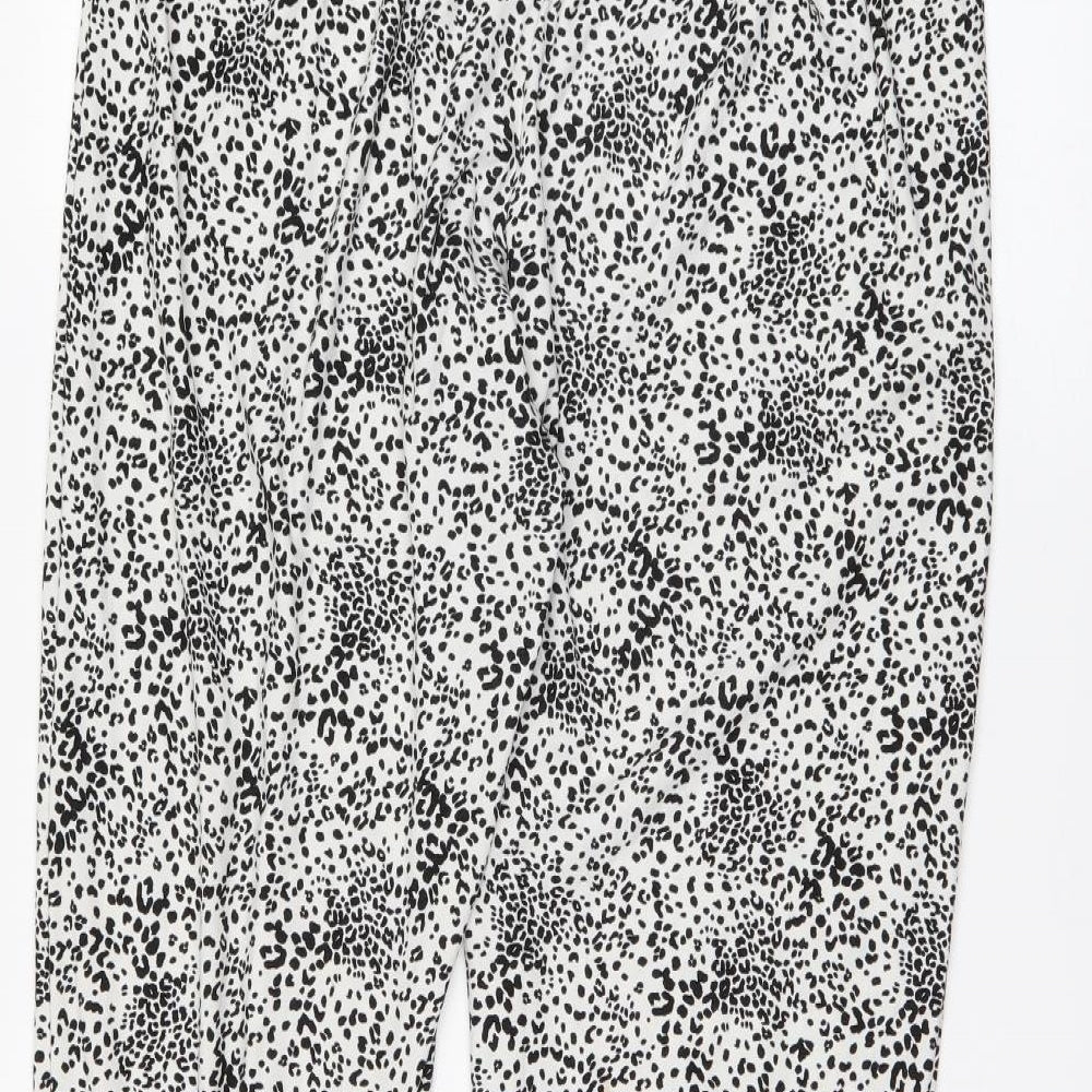 Brand and care label for Primark women’s white polka dot trousers, size M, 27-inch leg