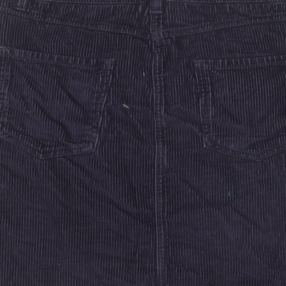 Brand and care label for Next women’s purple mini skirt, size UK 6
