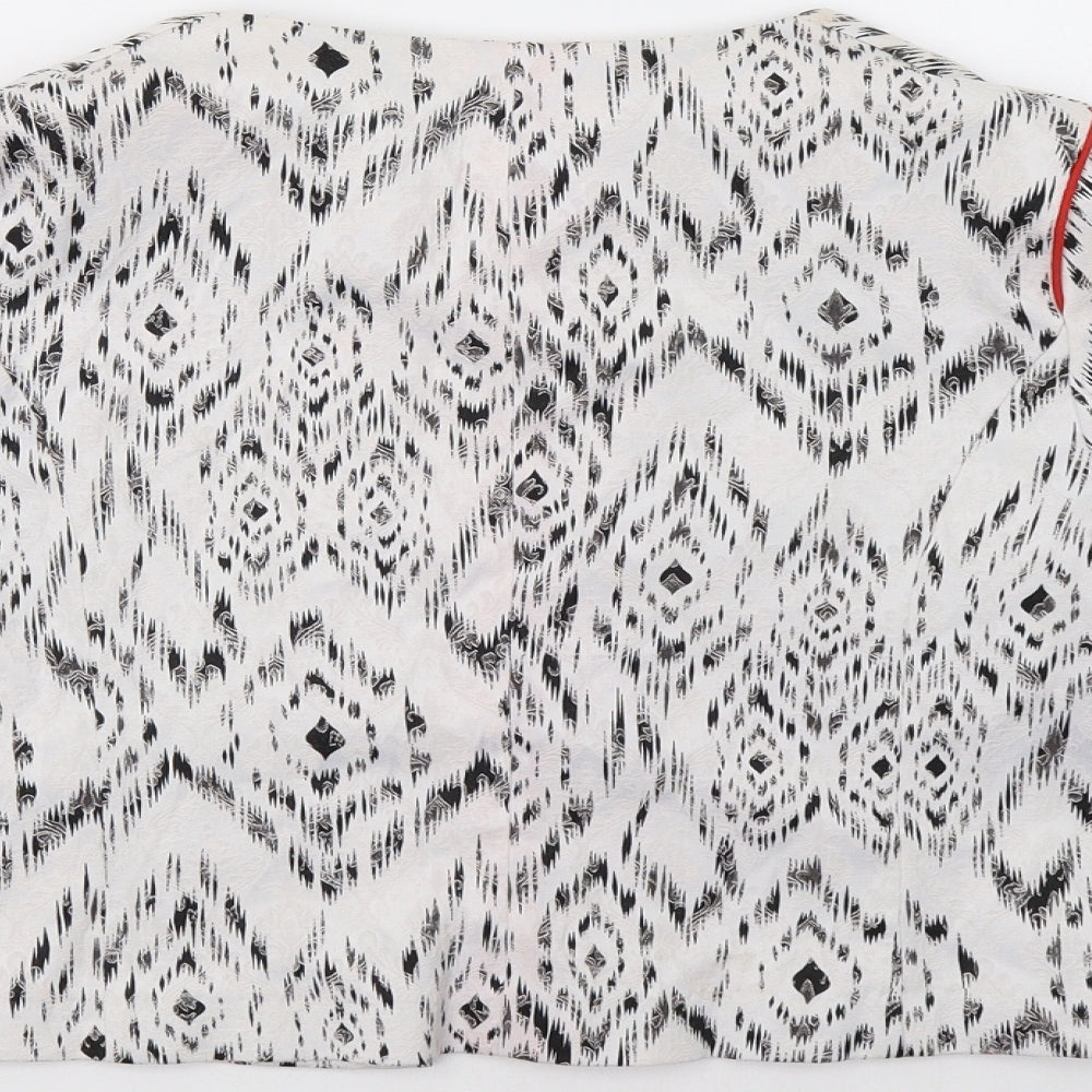 Brand and care label for Primark women’s white geometric jacket blazer, size UK 8