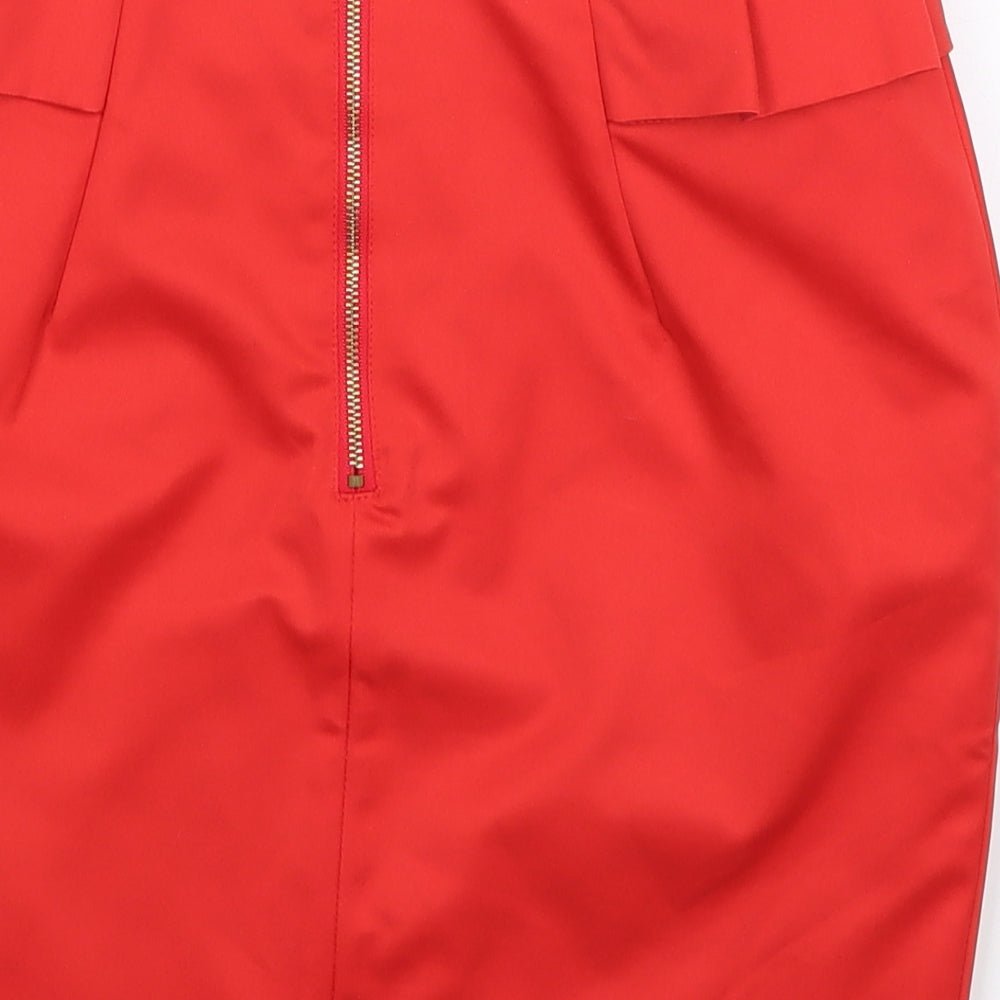 Brand and care label for H&M women’s red mini skirt, size UK 8