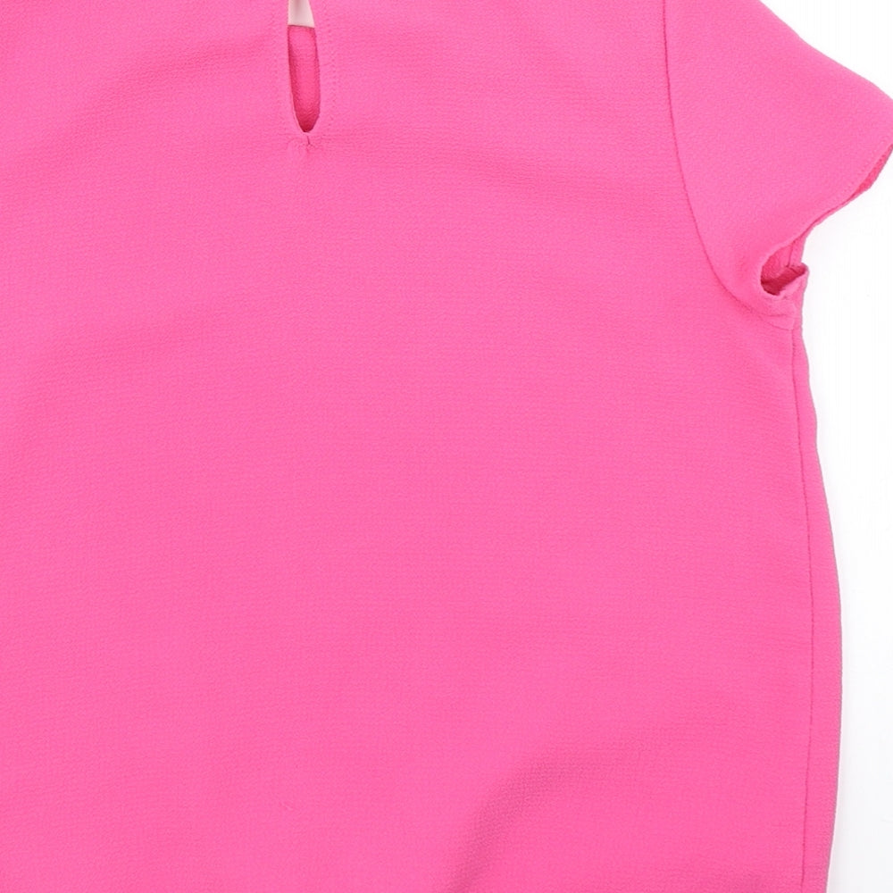 Brand and care label for George girls’ pink basic blouse, size 10, years