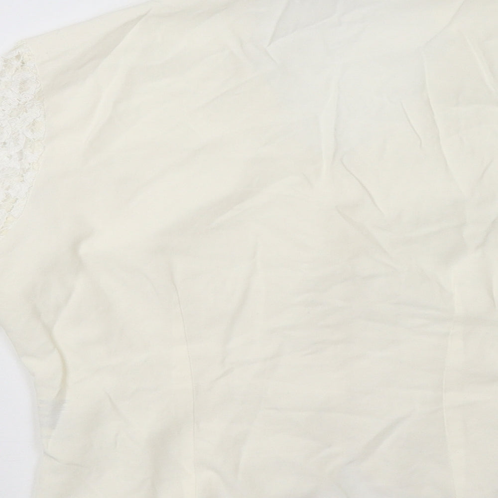 Brand and care label for Burton women’s white jacket, size UK 12
