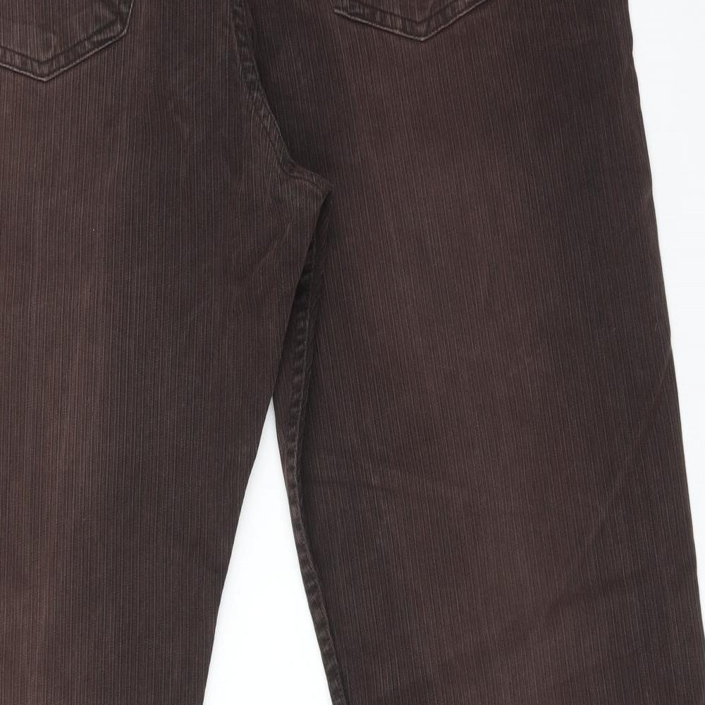 Brand and care label for Marks & Spencer women’s blue straight jeans, size UK 42, 31-inch leg