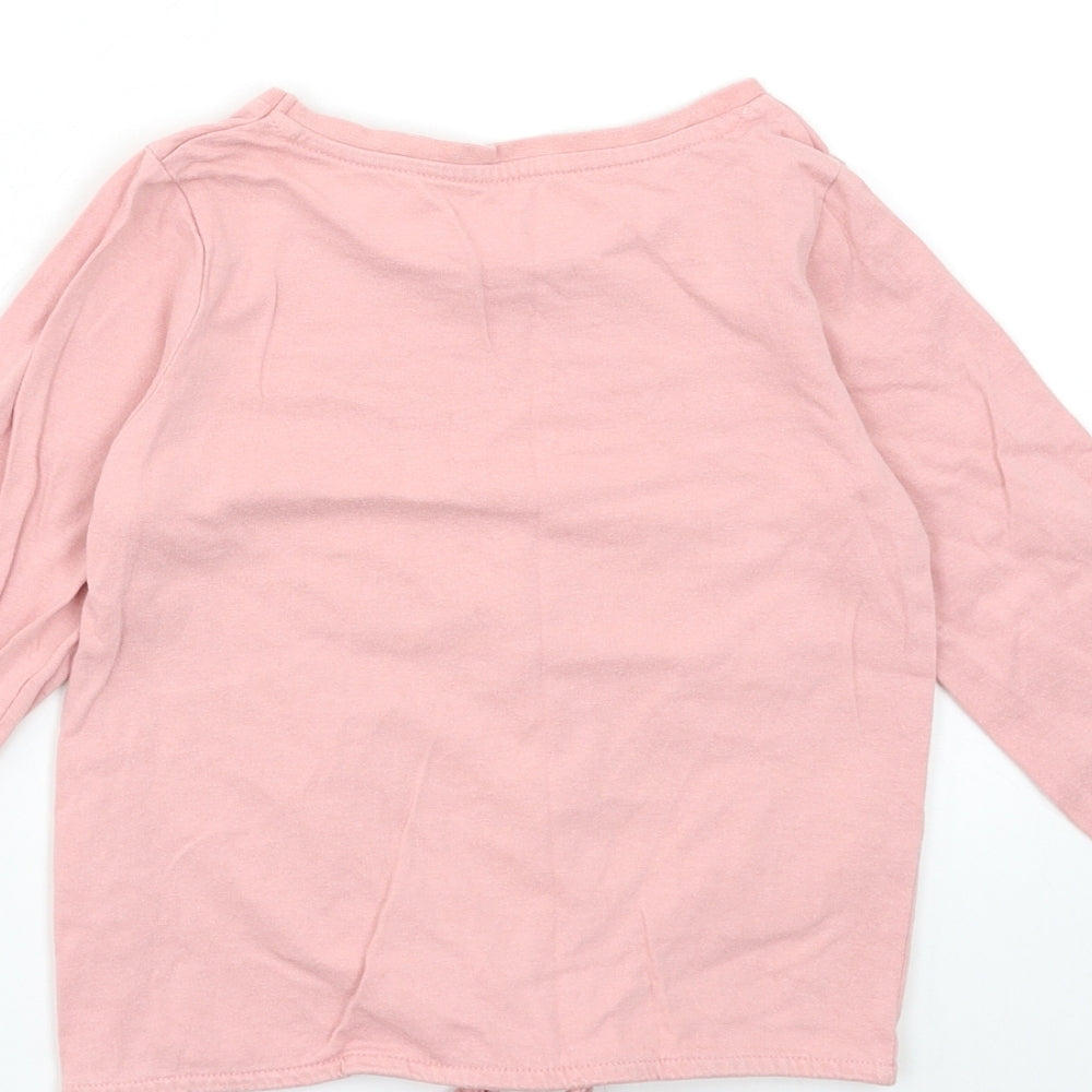 Brand and care label for Nutmeg girls’ pink basic t-shirt, size 5-6, years