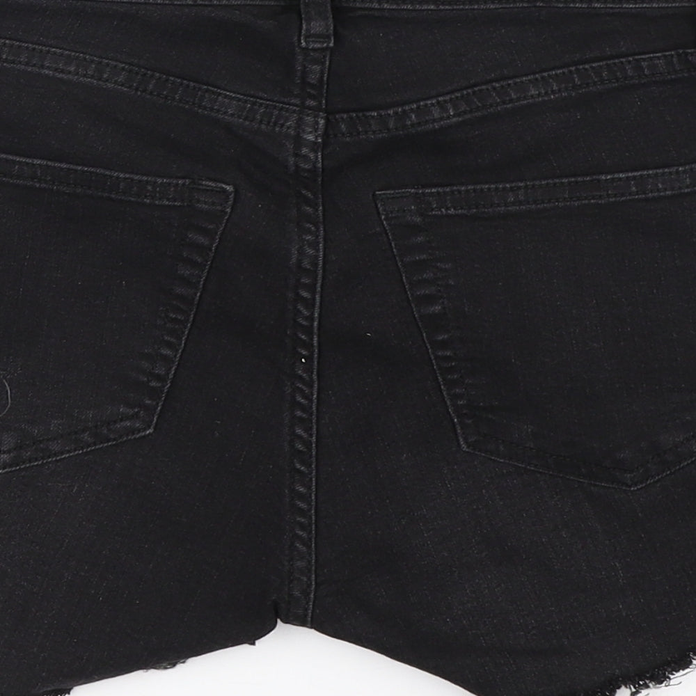 Brand and care label for H&M women’s black hot pants shorts, size UK 6