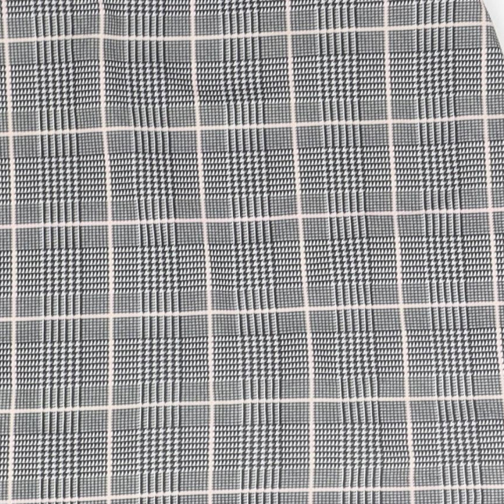 Brand and care label for PRETTYLITTLETHING women’s grey check a-line skirt, size UK 8