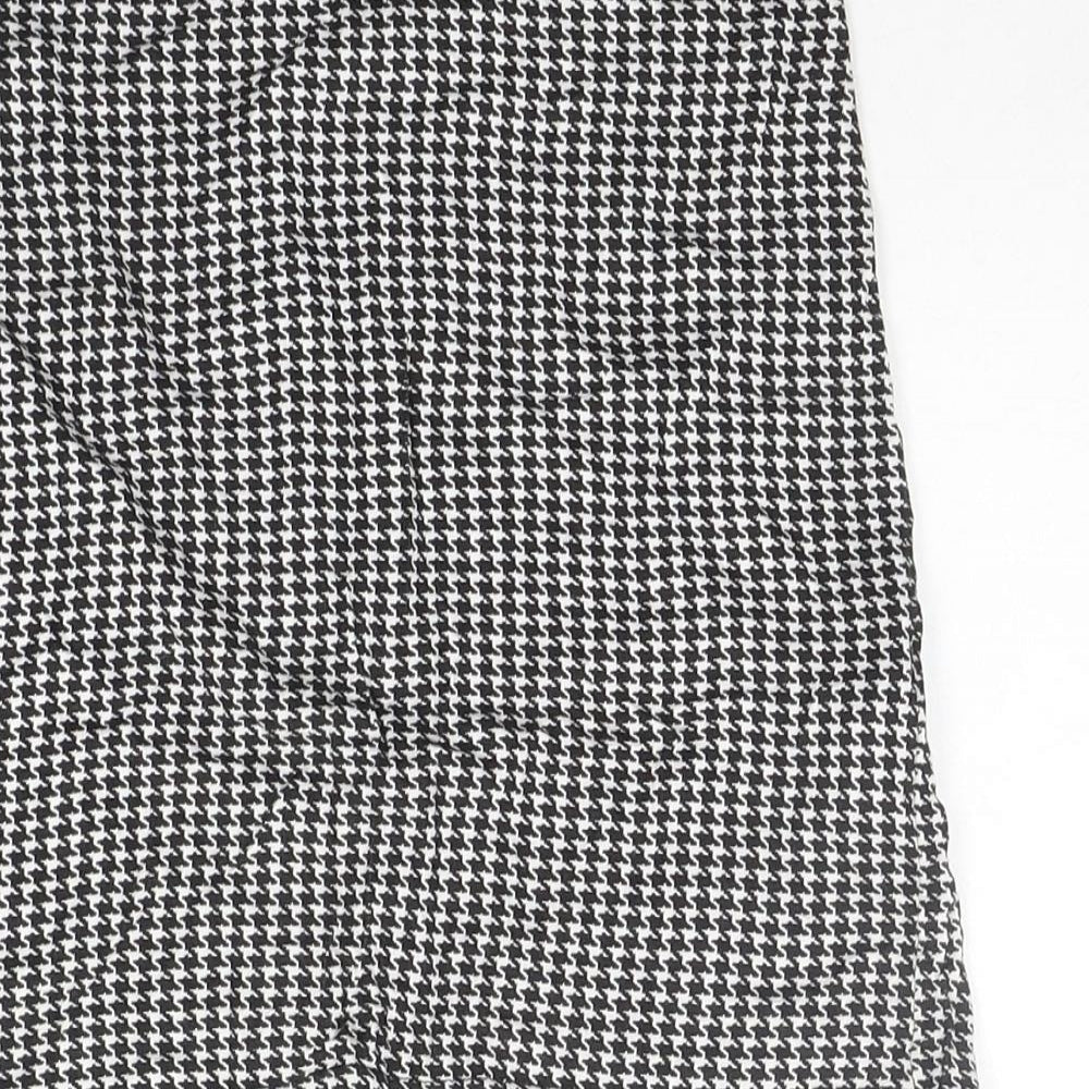Brand and care label for PRETTYLITTLETHING women’s grey check a-line skirt, size UK 8