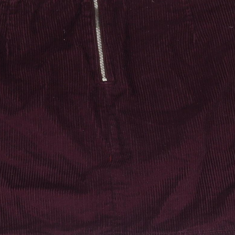 Brand and care label for F&F women’s red corduroy straight & pencil skirt, size UK 6