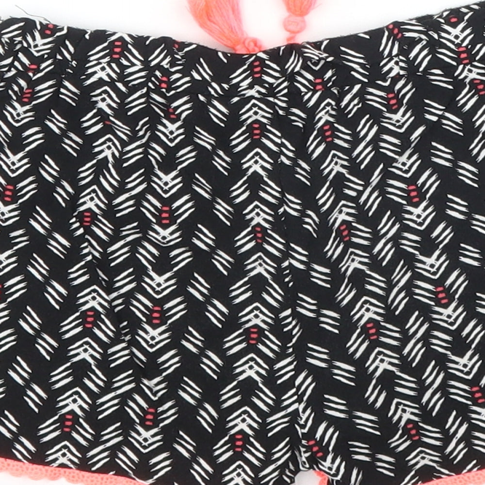 Brand and care label for Primark girls’ black striped bermuda shorts, size 6, years
