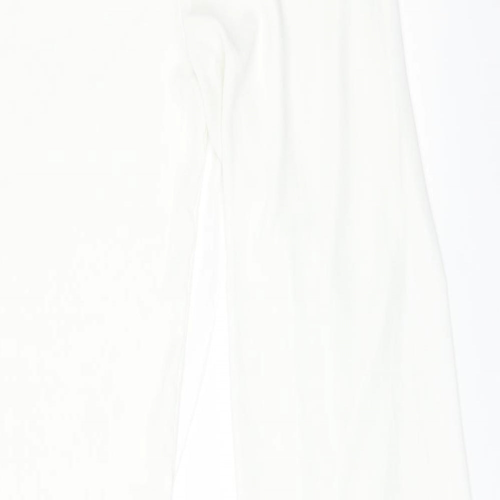 Brand and care label for VESTIDOS women’s white trousers, size S, 28-inch leg