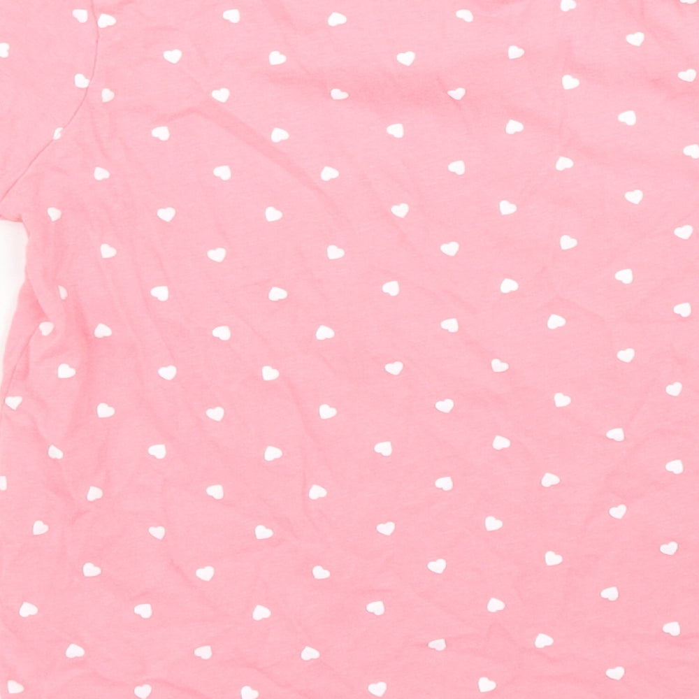 Brand and care label for Primark girls’ pink polka dot basic t-shirt, size 3, years