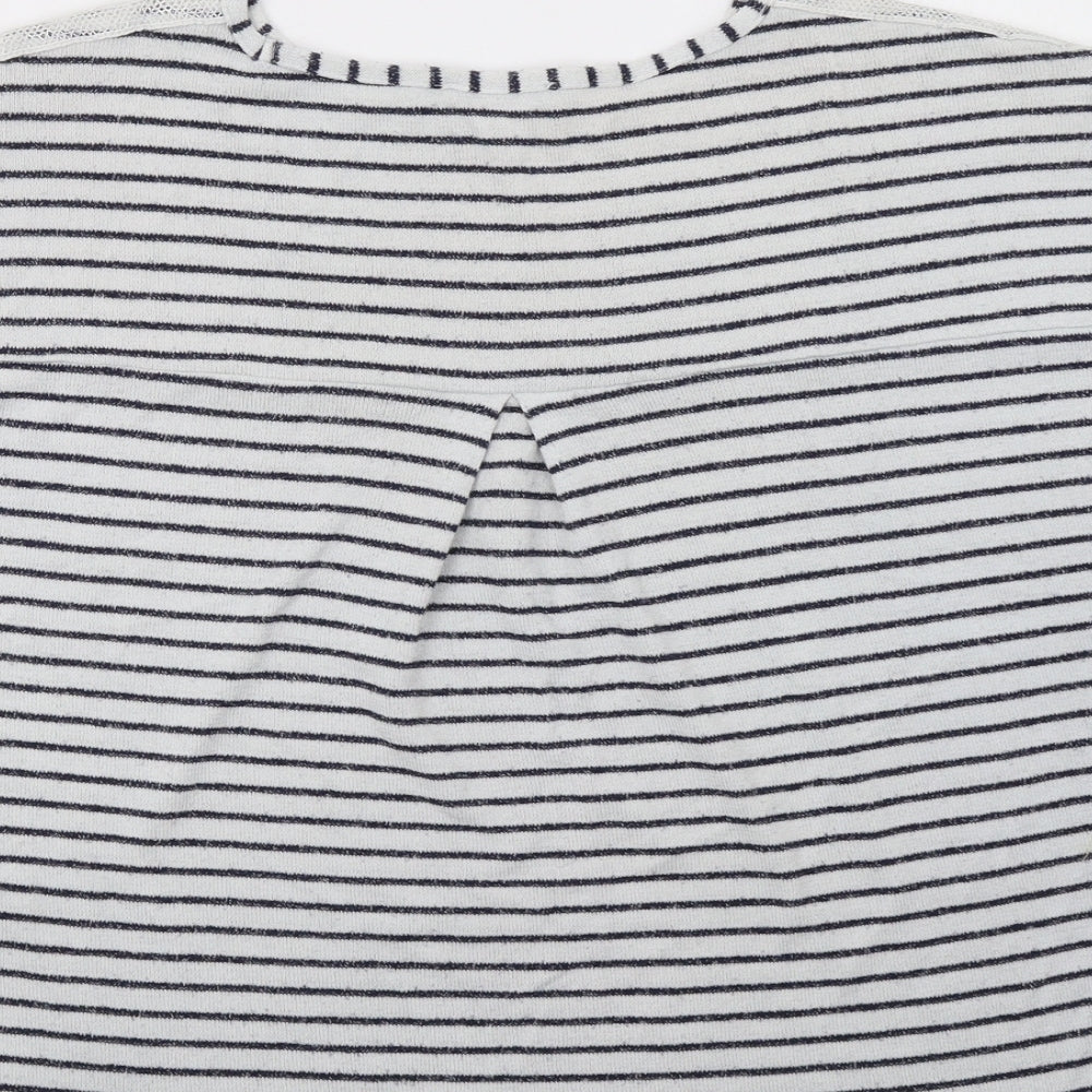 Brand and care label for TU women’s blue striped pullover sweatshirt, size UK 12