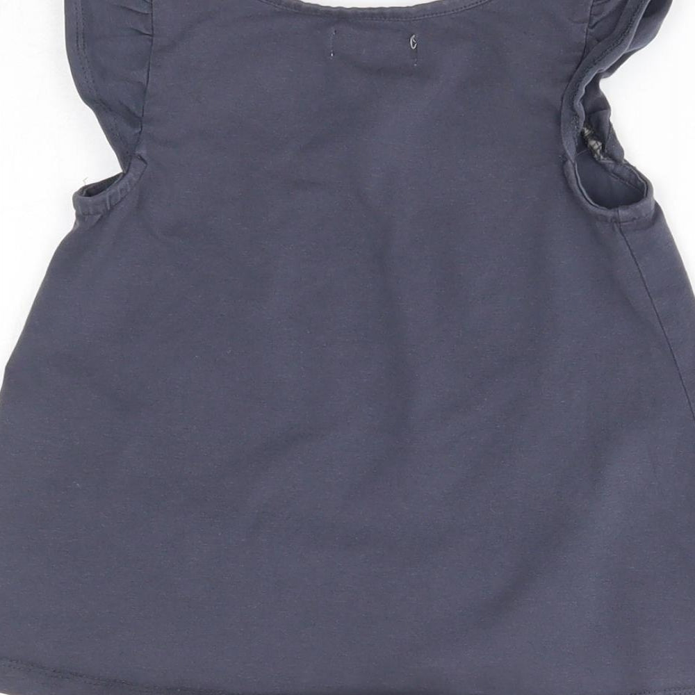 Brand and care label for Maggie & Zoe girls’ blue basic blouse, size 3-4, years