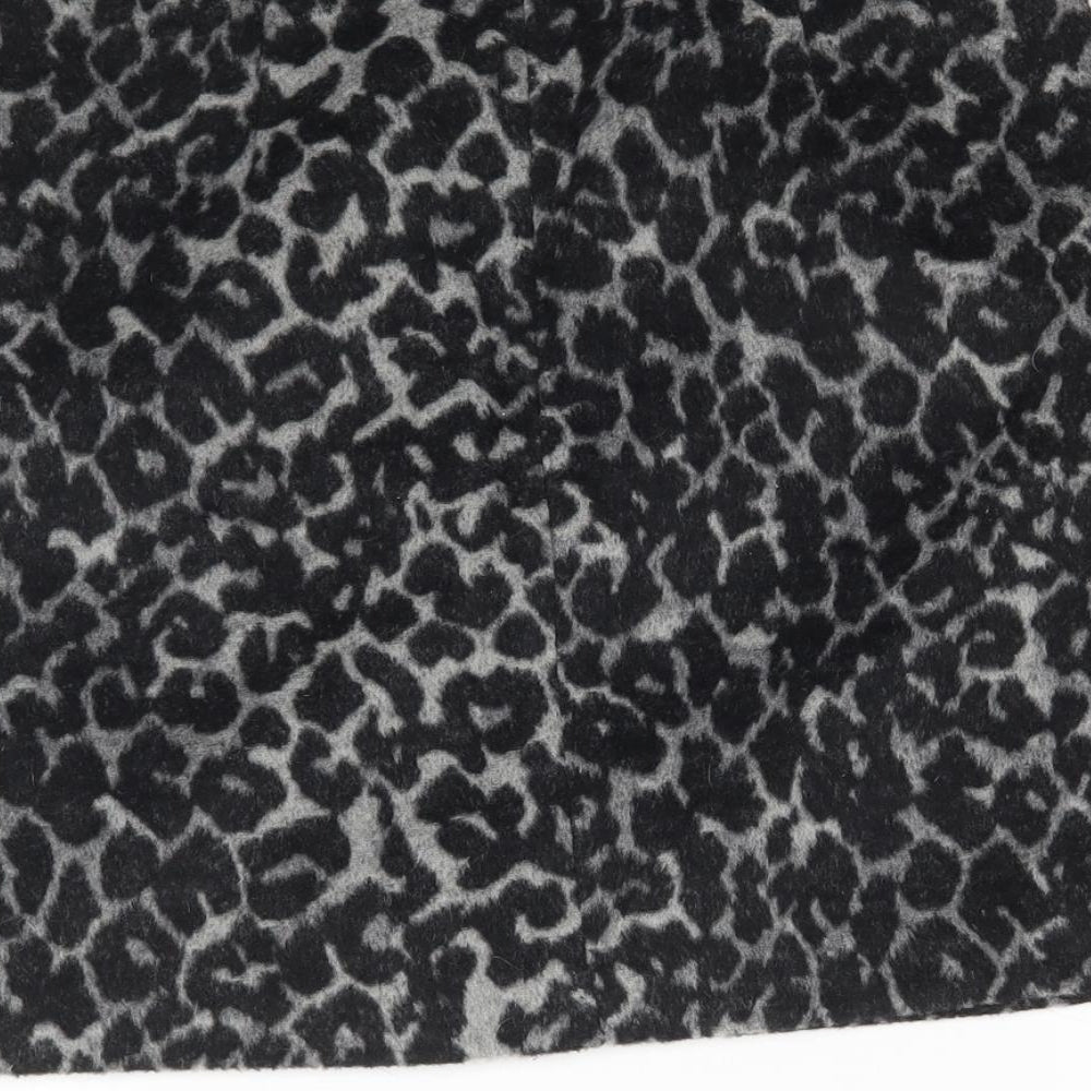 Brand and care label for Oasis women’s grey animal print mini skirt, size UK 6