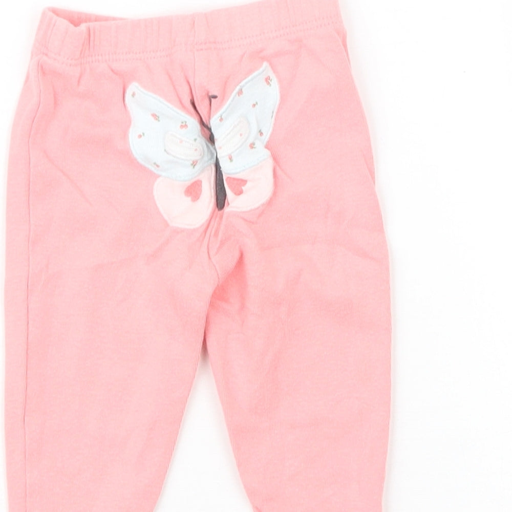 Brand and care label for Carter's girls’ pink capri leggings, size 0-3, months