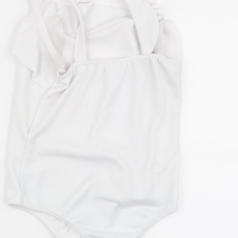 Brand and care label for Missguided women’s white bodysuit one-piece, size UK 6