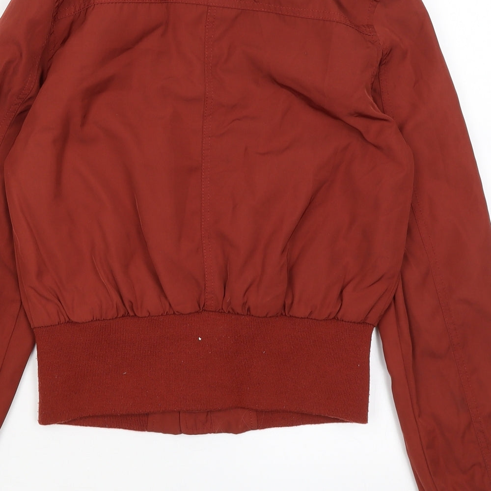 Brand and care label for Primark women’s red jacket, size UK 4