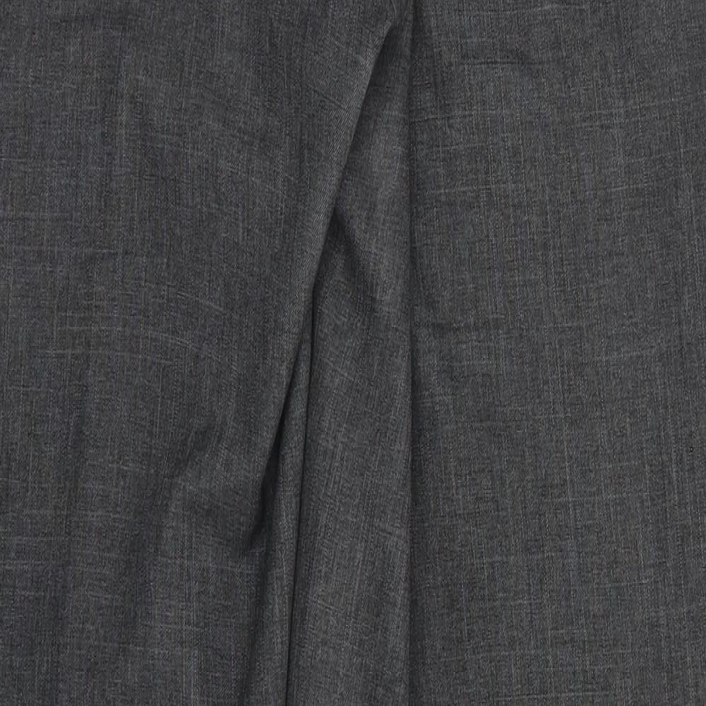 Brand and care label for Marks & Spencer men’s grey trousers, size 32, in, 30-inch leg