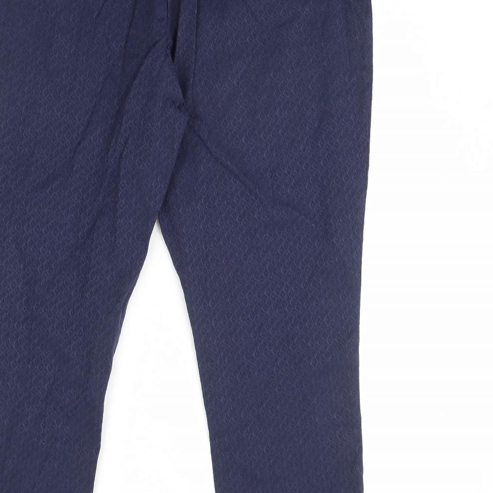 Brand and care label for F&F women’s blue trousers, size UK 40, in, 29-inch leg