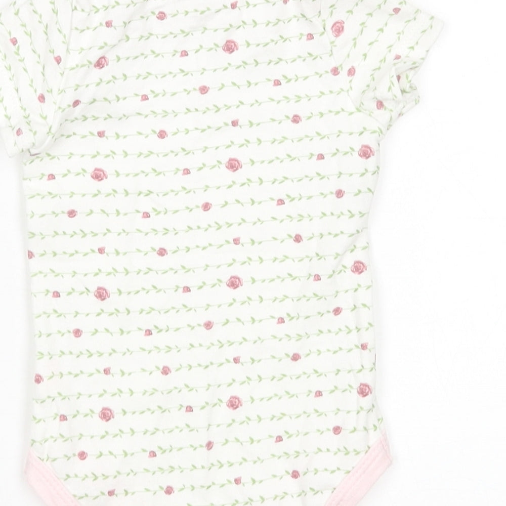 Brand and care label for Kyle & Deena girls’ multicoloured floral leotard one-piece, size 3-6, months