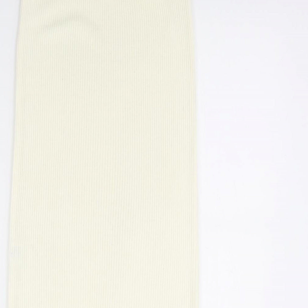 Brand and care label for Missguided women’s ivory bandage skirt, size UK 8