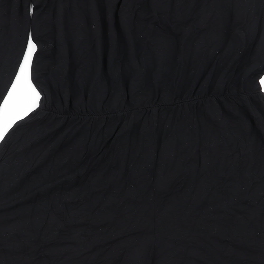 Brand and care label for Missguided women’s black playsuit one-piece, size UK 8
